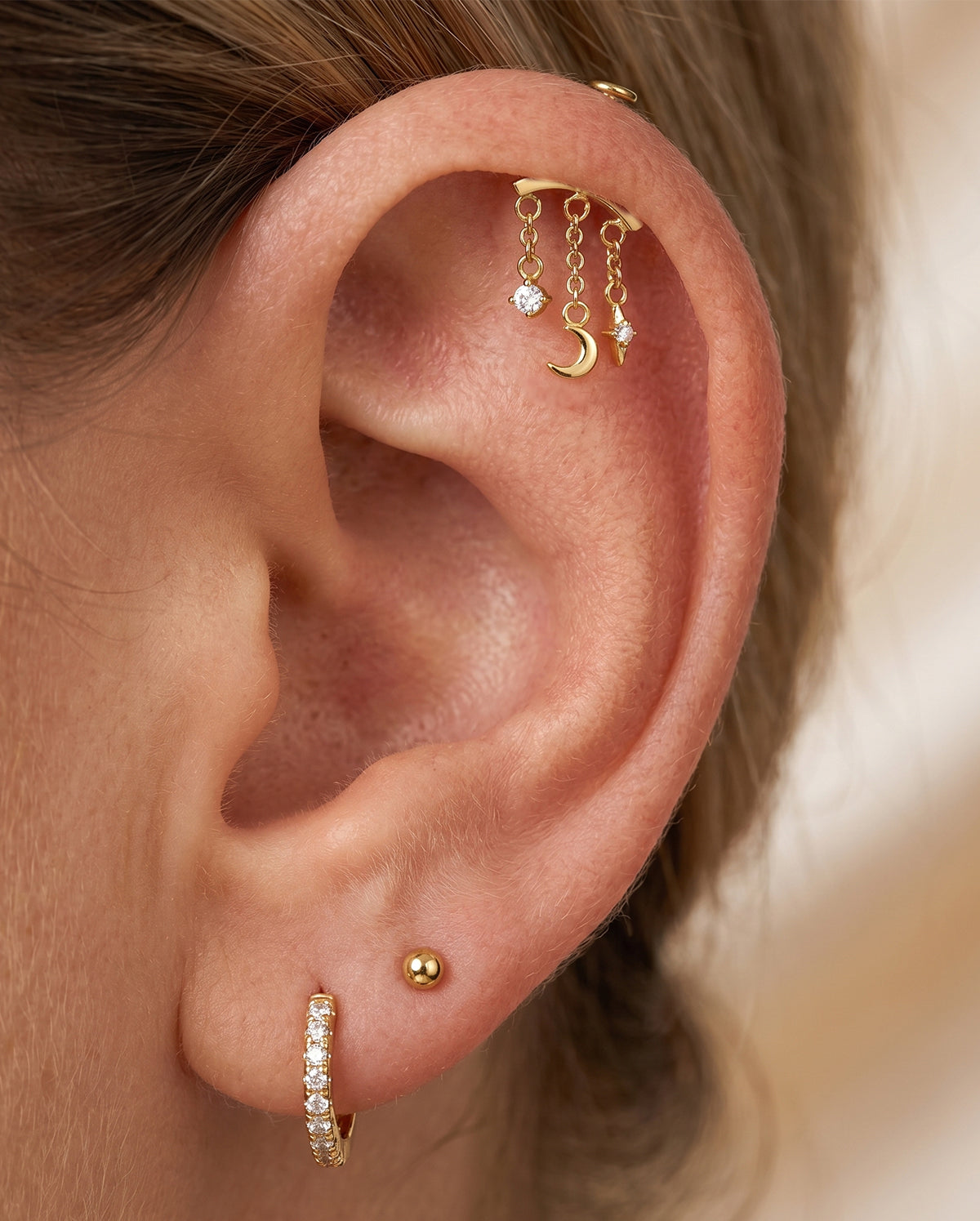 gold moon and star helix piercing