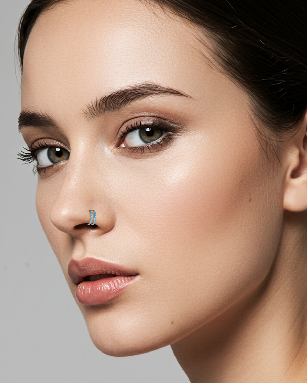 turquoise double hoop nose piercing