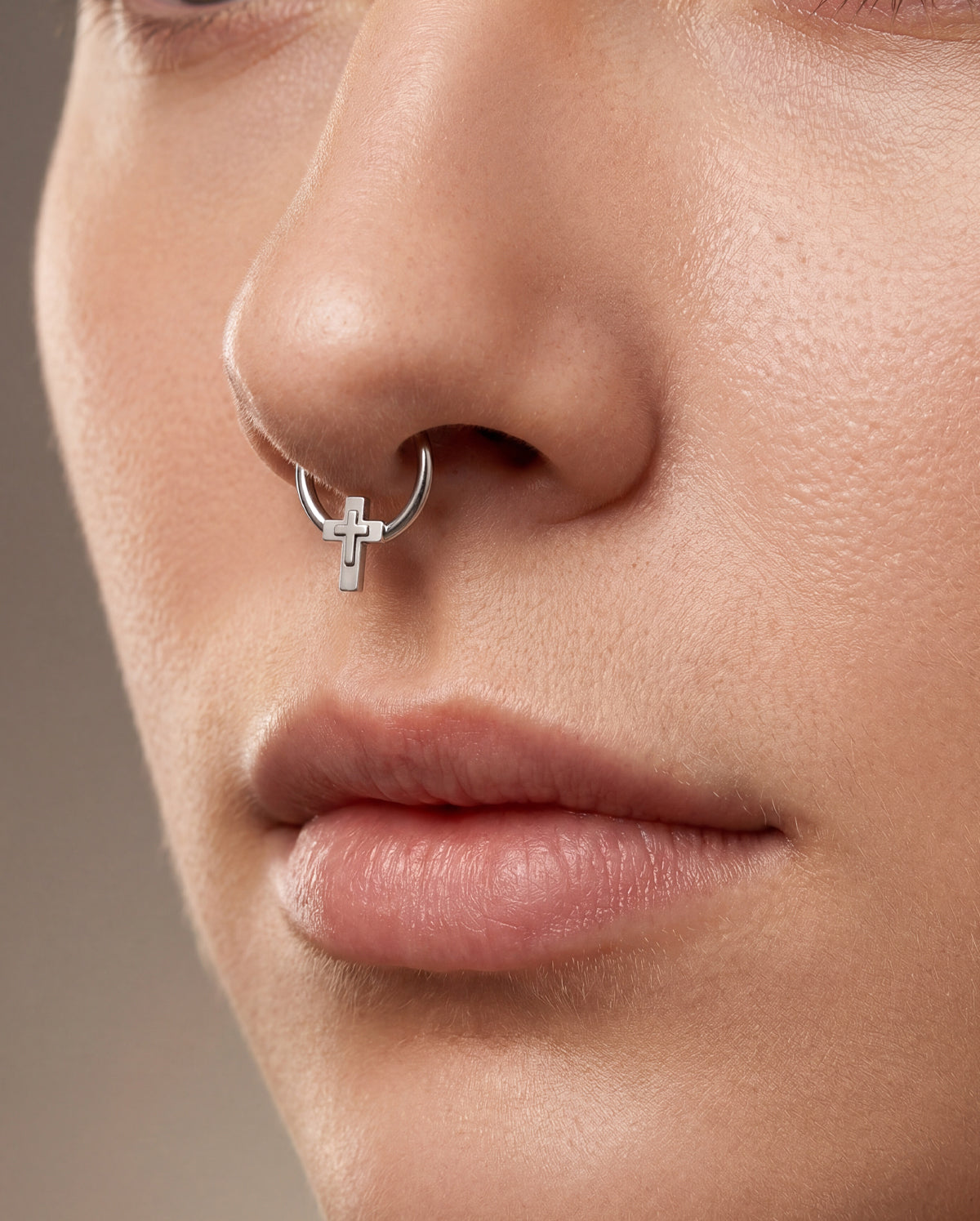 cross septum piercing