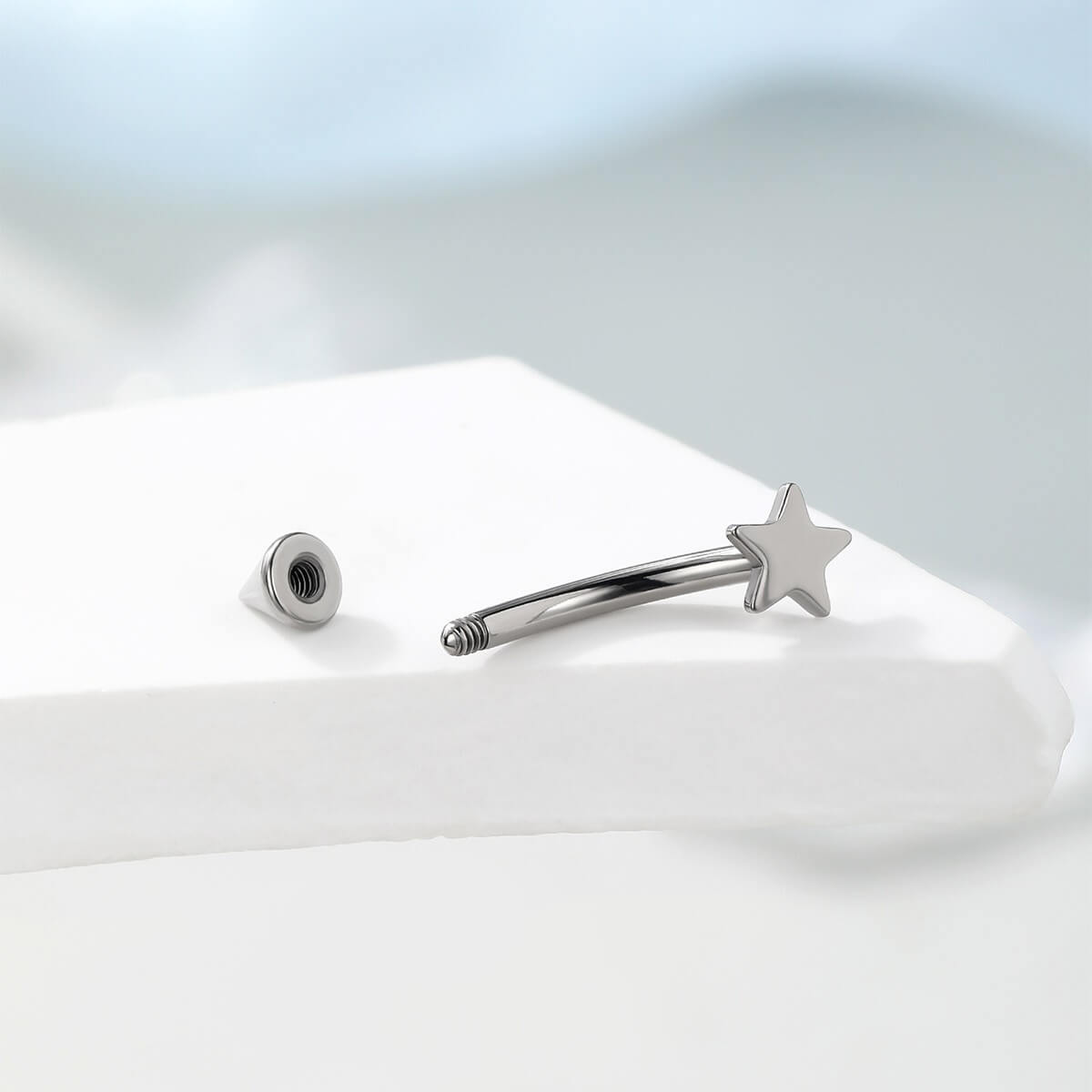 Star Curved Titanium Eyebrow Ring
