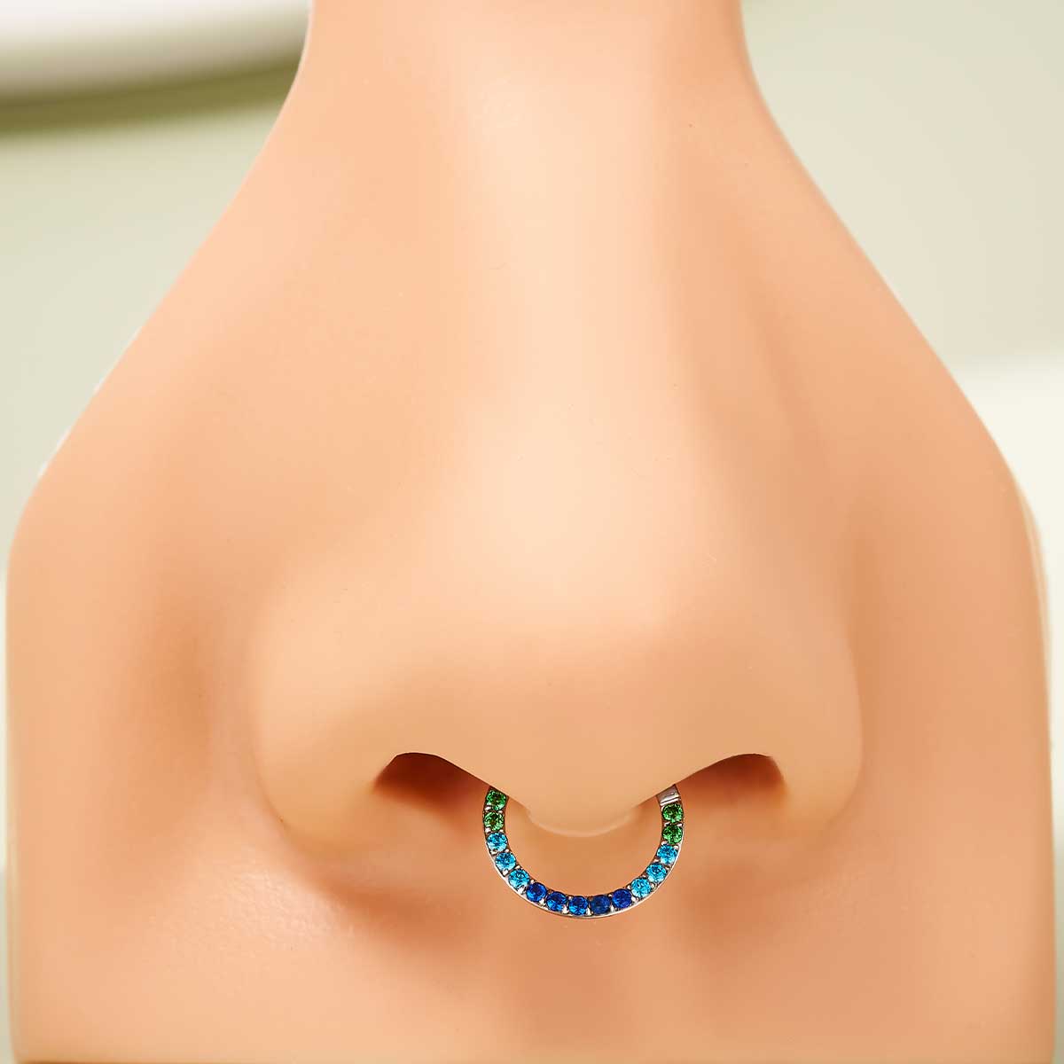 blue and green septum piercing